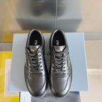 Prada unisex sneakers, pair view, dark gray leather with lace-up and perforated detailing