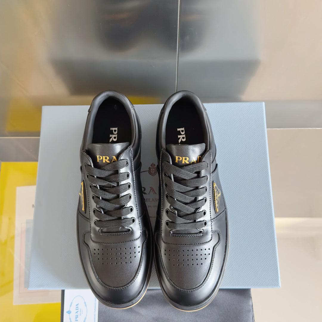 Prada unisex sneakers, pair view, dark gray leather with lace-up and perforated detailing