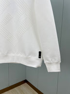 White Fendi sweatshirt sleeve with ribbed cuff and small logo tag at hem