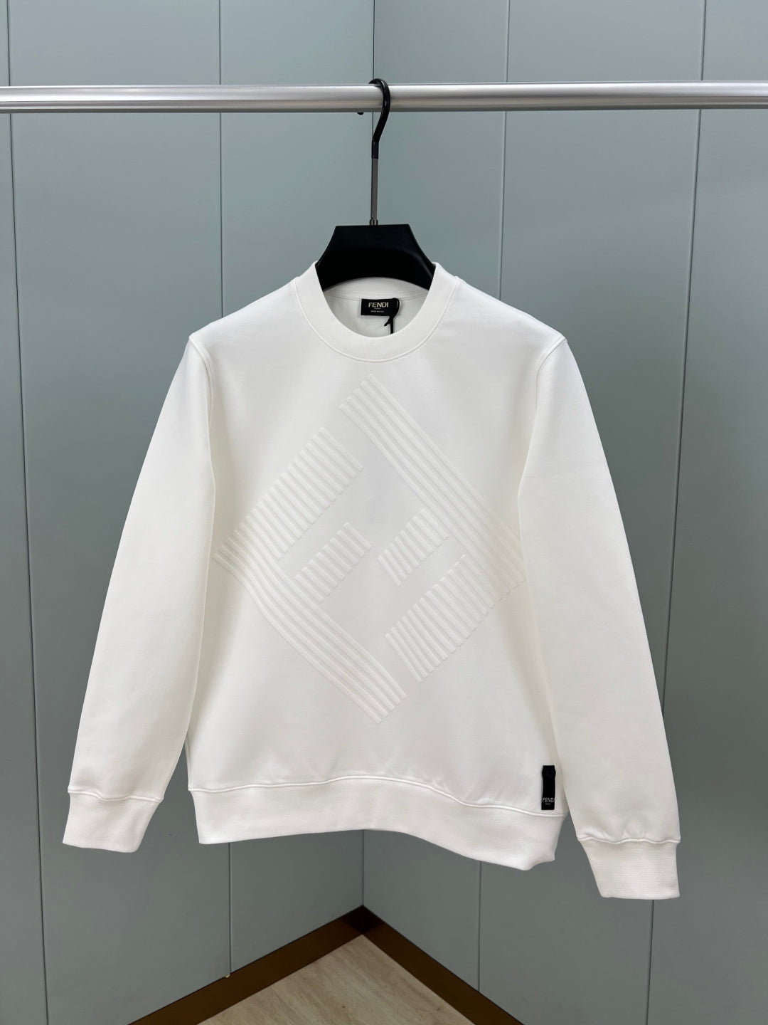 White Fendi sweatshirt with raised diagonal logo pattern and ribbed crew neck