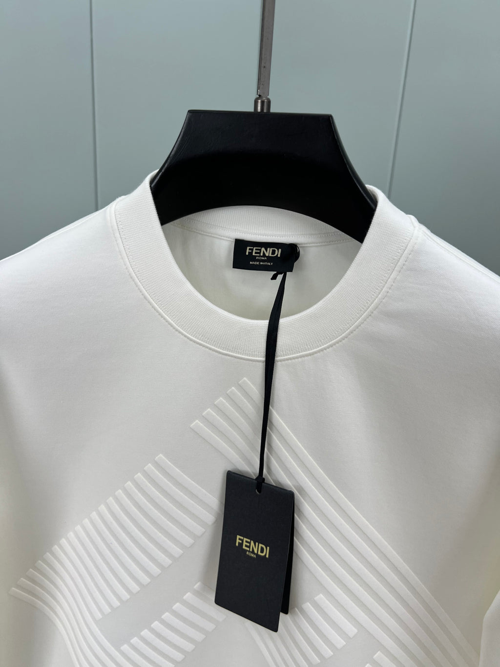 Fendi logo crewneck sweatshirt collar with black brand tag and raised pattern