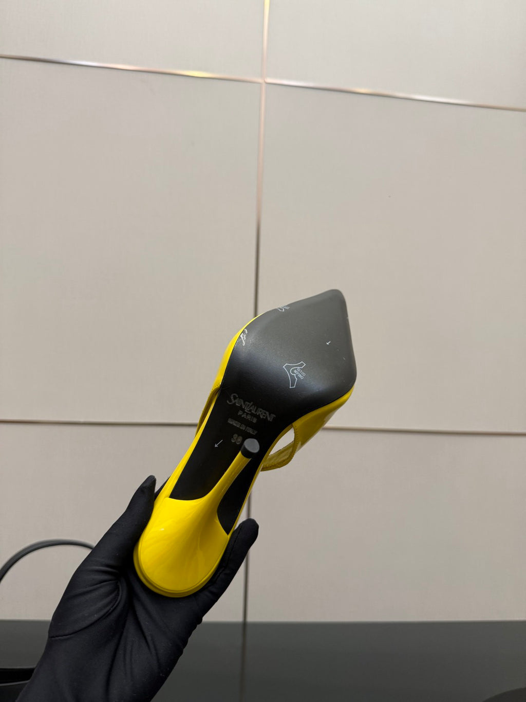 Yellow and black pointed-toe high-heel slingback shoe, sole and heel detail