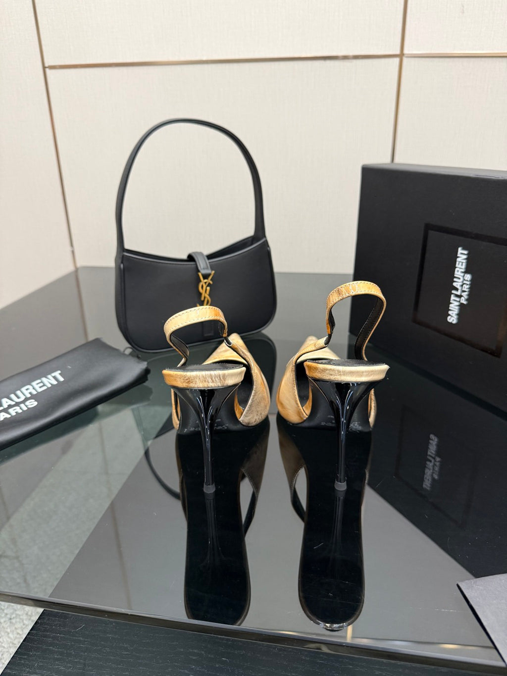 Women’s black slingback heels with tan speckled finish and stiletto heel