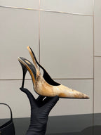 Women’s slingback pump heel with tan speckled pattern and black heel strap