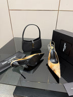Women’s pointed-toe slingback heels and black handbag, with tan speckled print
