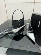 YSL ladies pointed-toe stiletto heels, black and silver metallic, side view