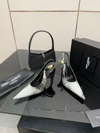 YSL ladies stiletto pumps, pointed toes, black and silver metallic, angled view
