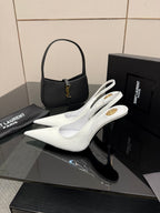 White pointed-toe slingback stiletto heels with slim high heel