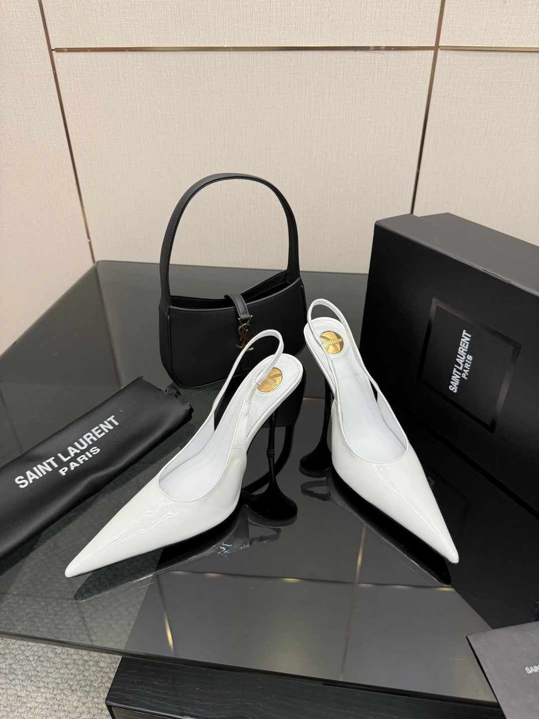 White pointed-toe slingback stiletto heels with slim high heel, side view