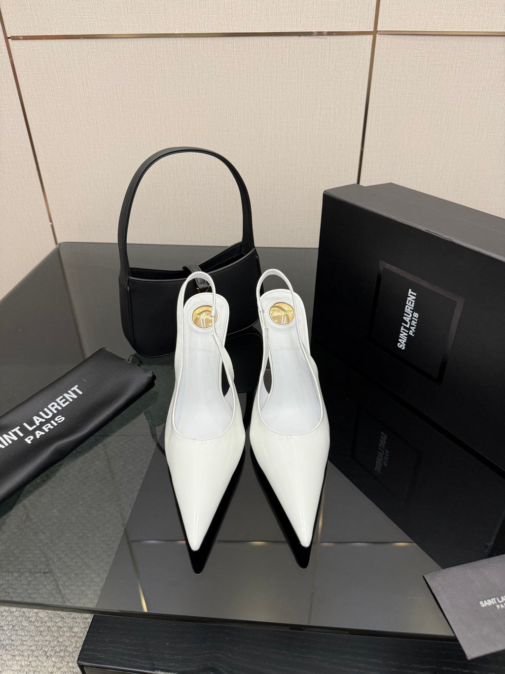 White pointed-toe stiletto heels with slim high heel