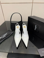 White pointed-toe stiletto heels with slim high heel