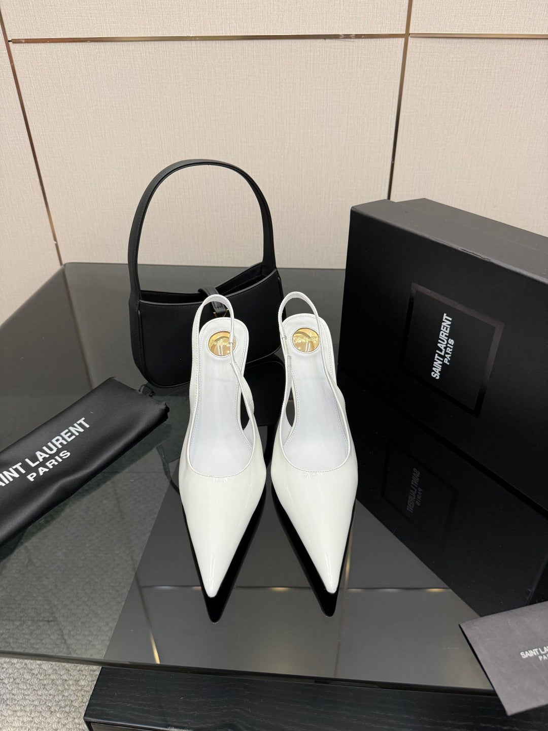 White pointed-toe stiletto heels with slim high heel