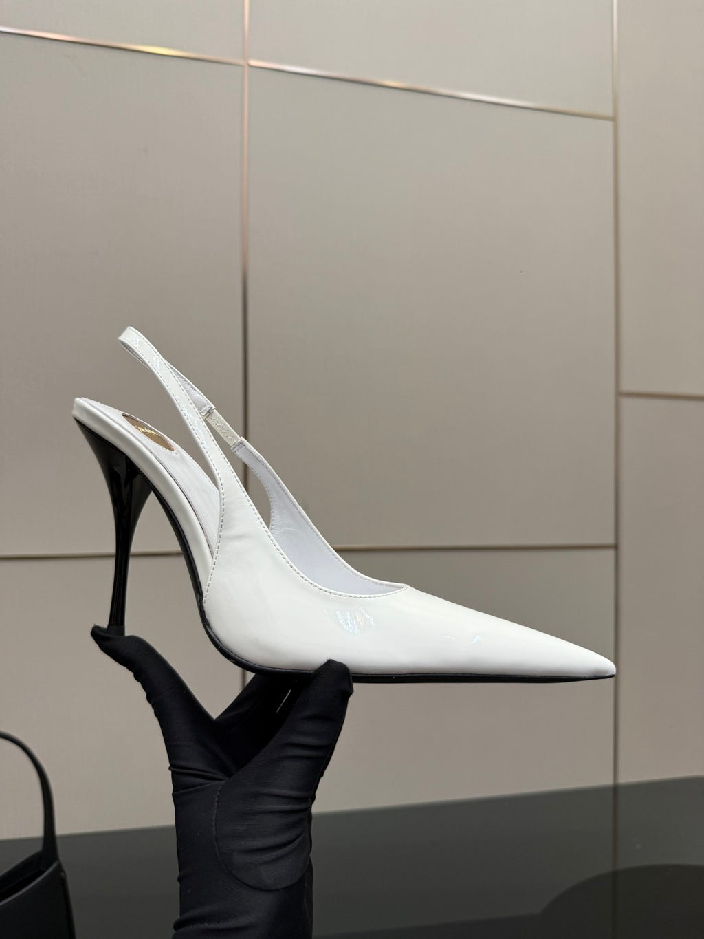 White slingback pointed-toe stiletto heel shoe with slim high heel, side angle