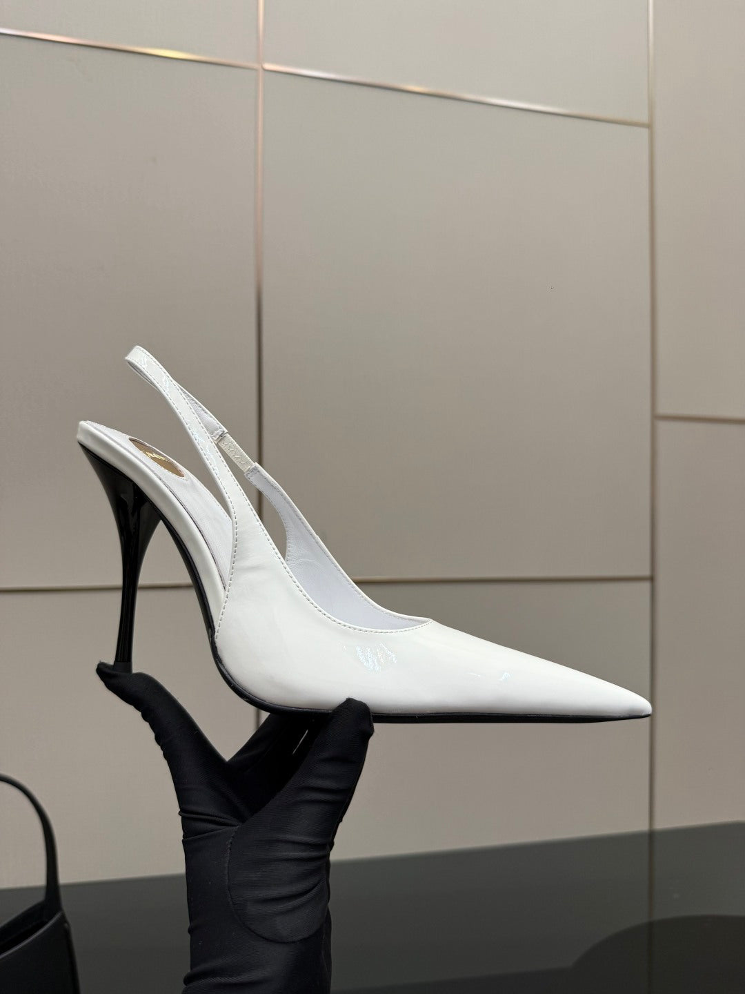 White slingback pointed-toe stiletto heel shoe with slim high heel, side angle
