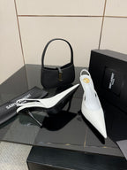 White pointed-toe slingback stiletto heels with slim high heel, side angle