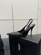 Black patent slingback stiletto heel shoes with pointed toe and high heel