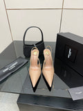 Nude patent leather pointed-toe stiletto heels with gold-tone YSL emblem, pair