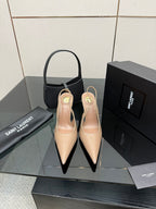 Nude patent leather pointed-toe stiletto heels with gold-tone YSL emblem, pair