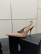 Nude patent leather pointed-toe stiletto heel with slingback strap, side view