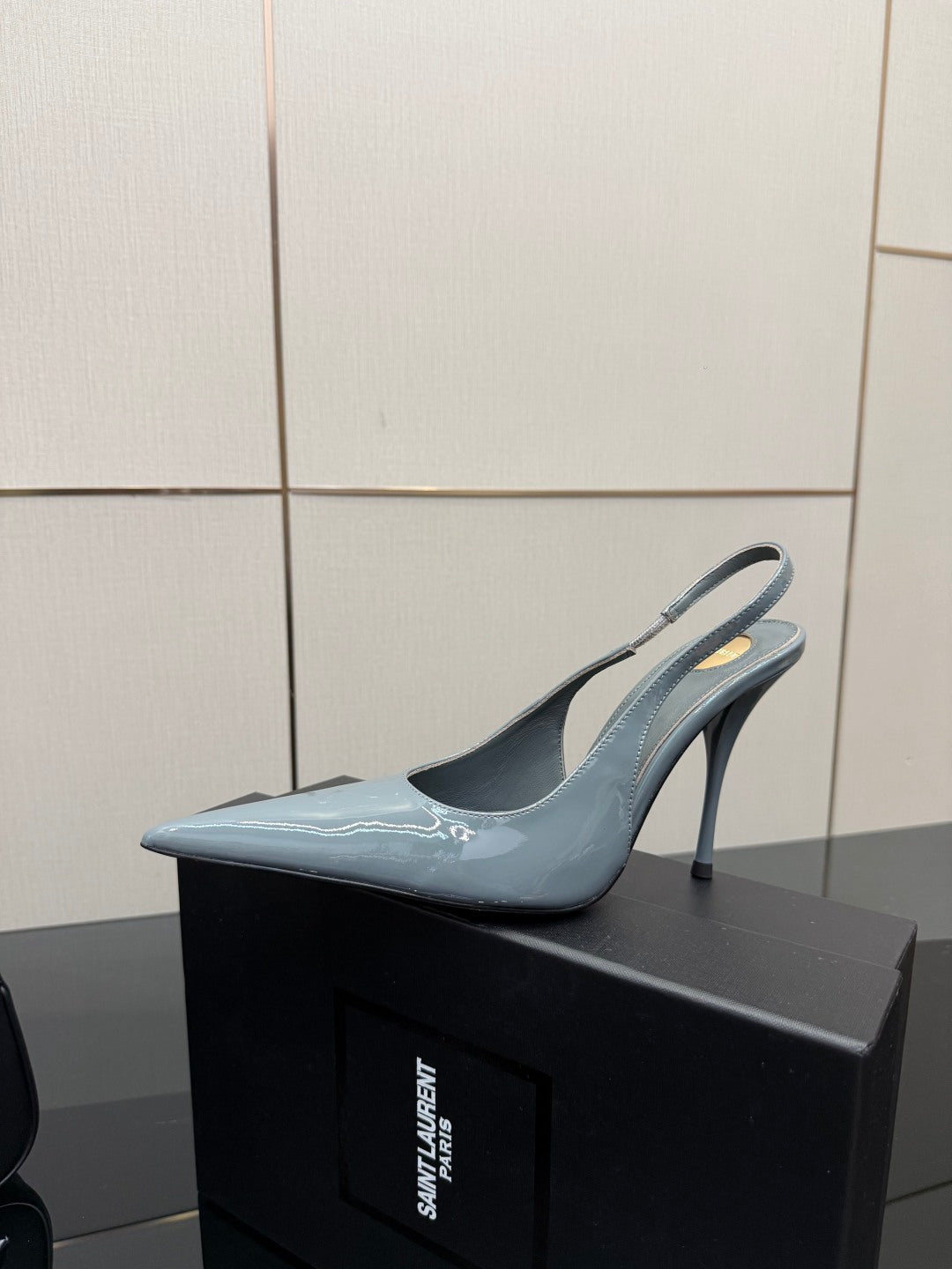 Light blue pointed-toe slingback stiletto heel with slim high heel, glossy.