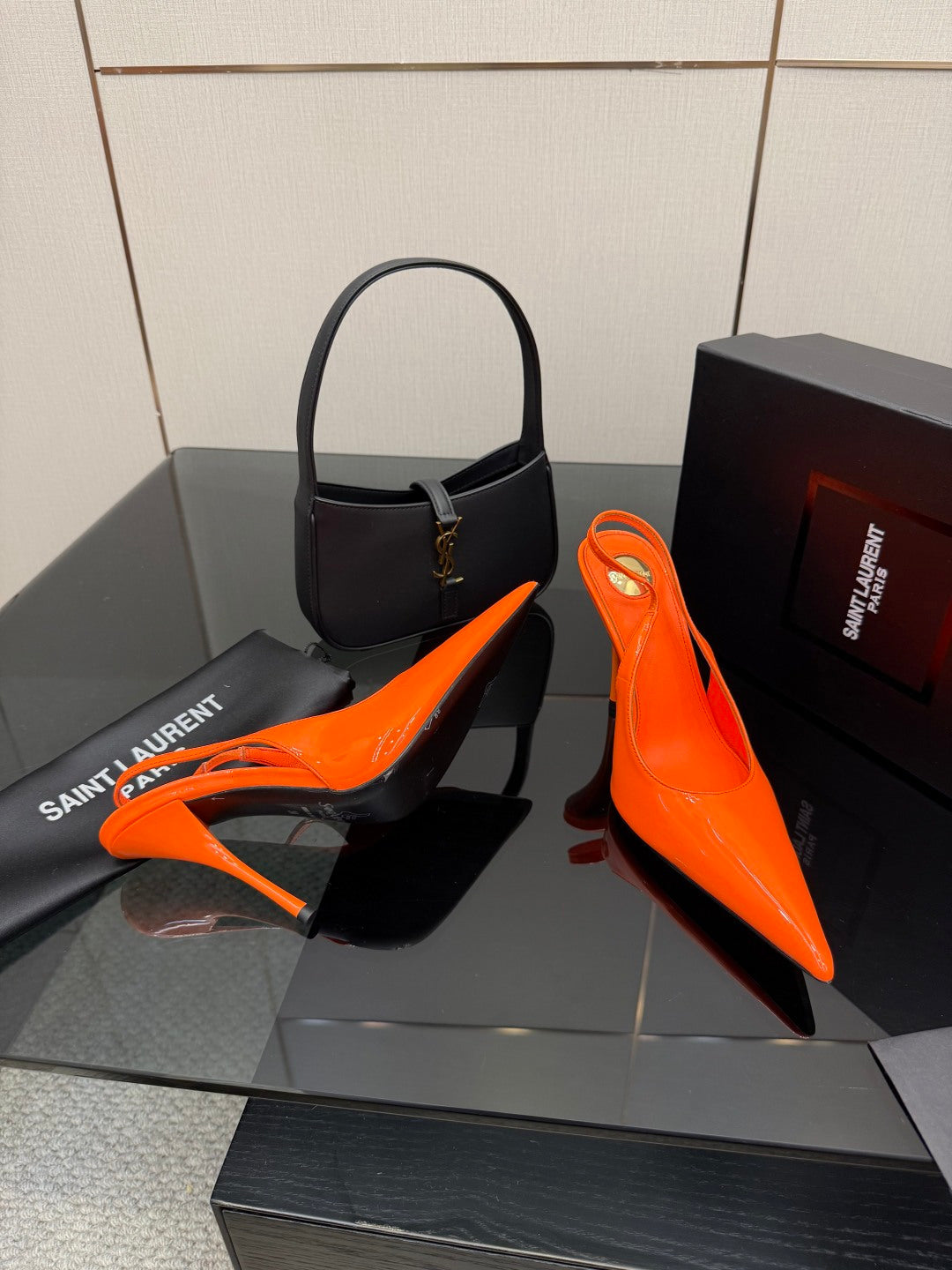 Orange pointed-toe high-heel slingback pumps with slender stiletto heel