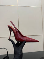 Women’s YSL red patent pointed-toe stiletto pump, angled side view, glossy upper