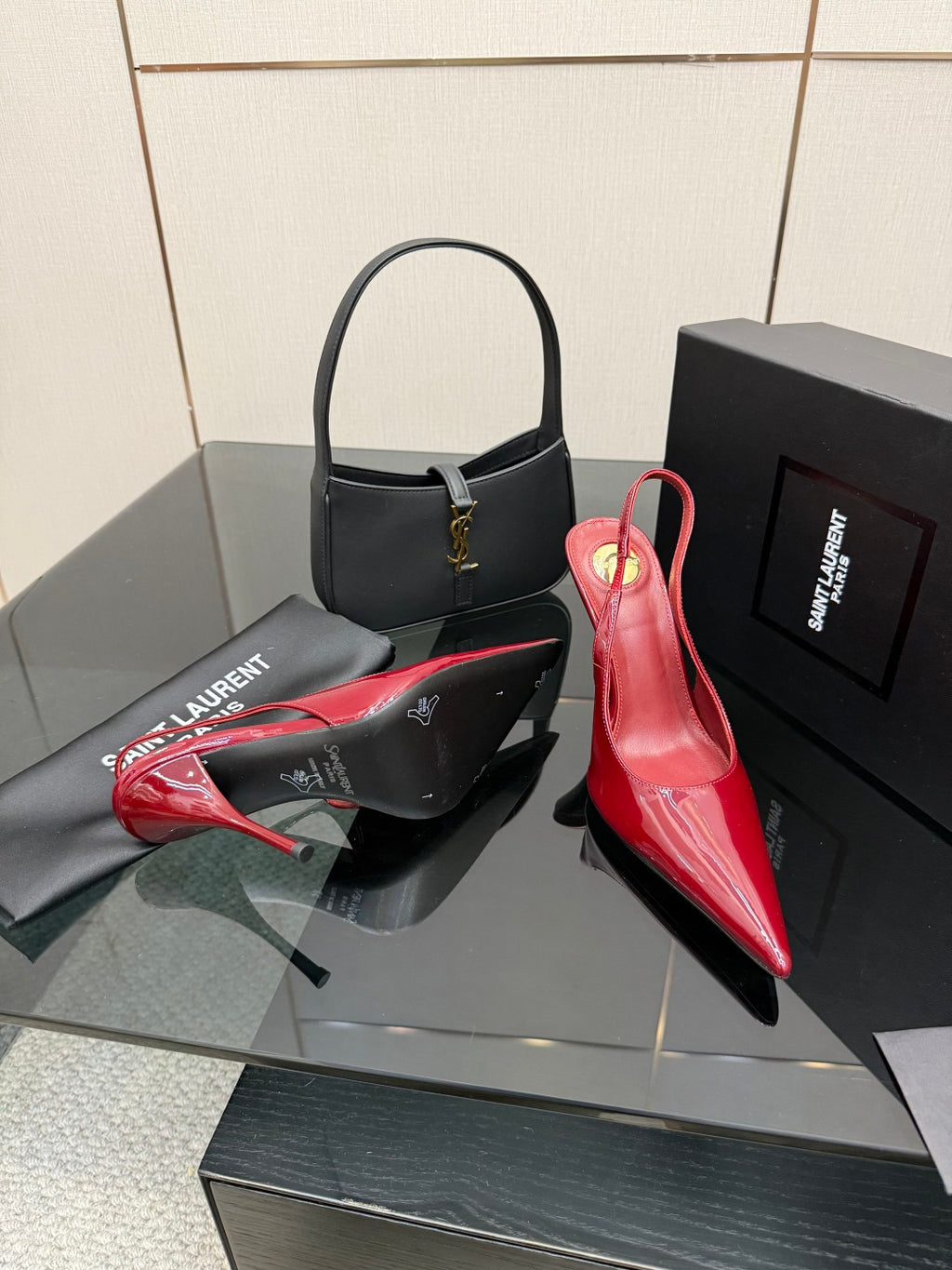 Women’s YSL red patent pointed-toe stiletto pumps, side angle, high slender heel