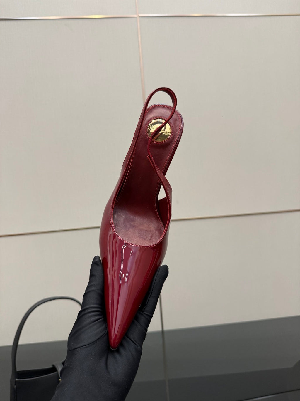 Women’s YSL red patent pointed-toe sling pump, narrow heel, glossy finish
