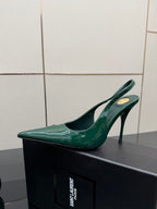 Single green patent pointed-toe slingback heel with stiletto heel, side view.