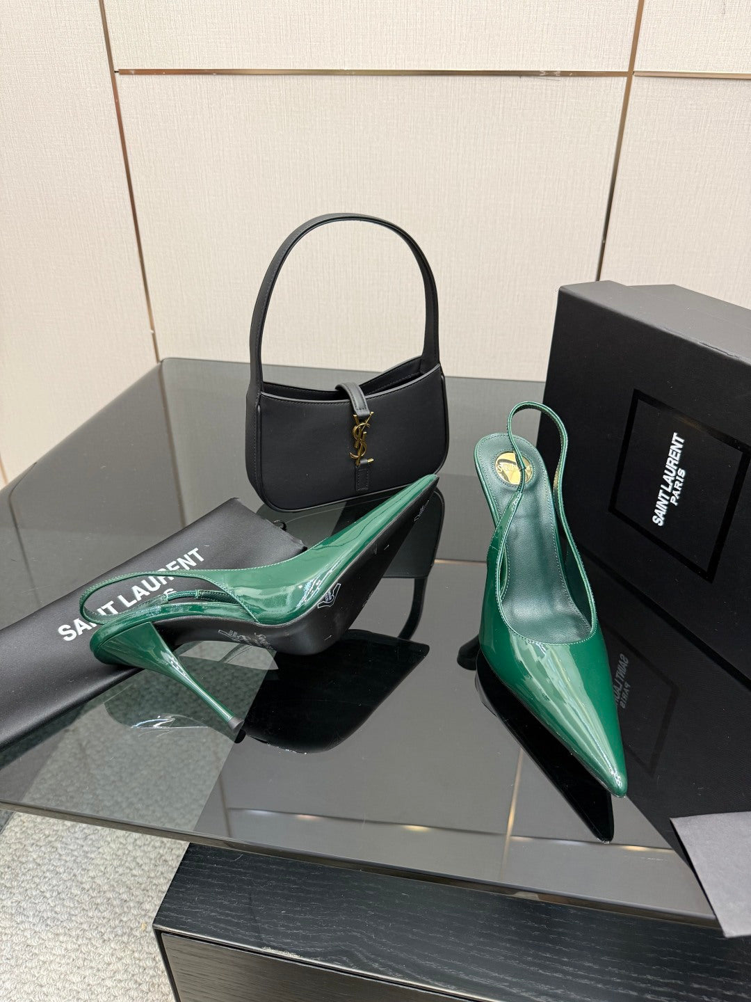 Green patent pointed-toe stiletto heels with slingback strap, front three-quarter view.