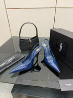 Ladies’ glossy blue pointed-toe high-heel pumps with slim stiletto heels