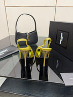 Back view of lime-green patent slingback heels with ankle strap and thin stiletto heels