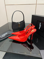 Red patent pointed-toe slingback stiletto heels on display with thin high heel