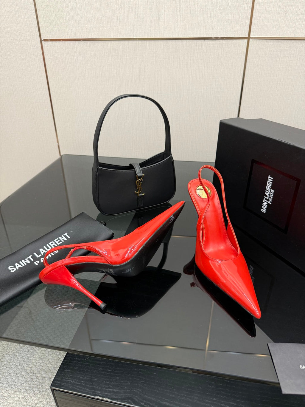 Red patent pointed-toe stiletto slingback heels with glossy finish and slim heel
