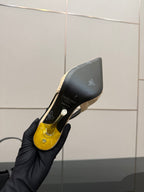 YSL slingback pump heel sole close-up: black outsole with gold accent