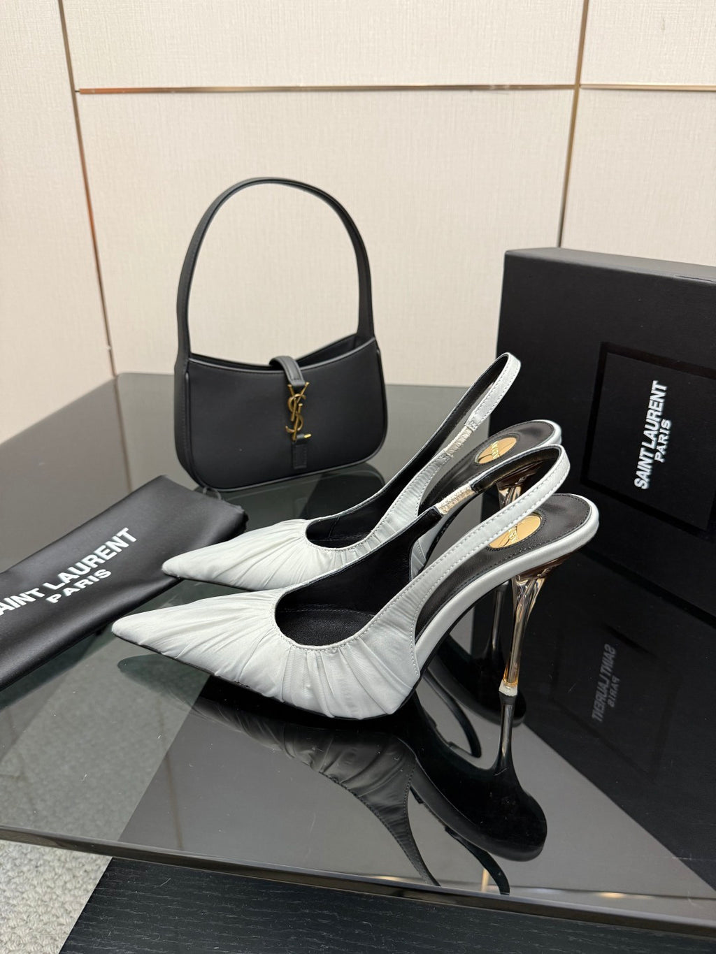YSL ladies white leather slingback heels with pointed toe and gold accent on strap