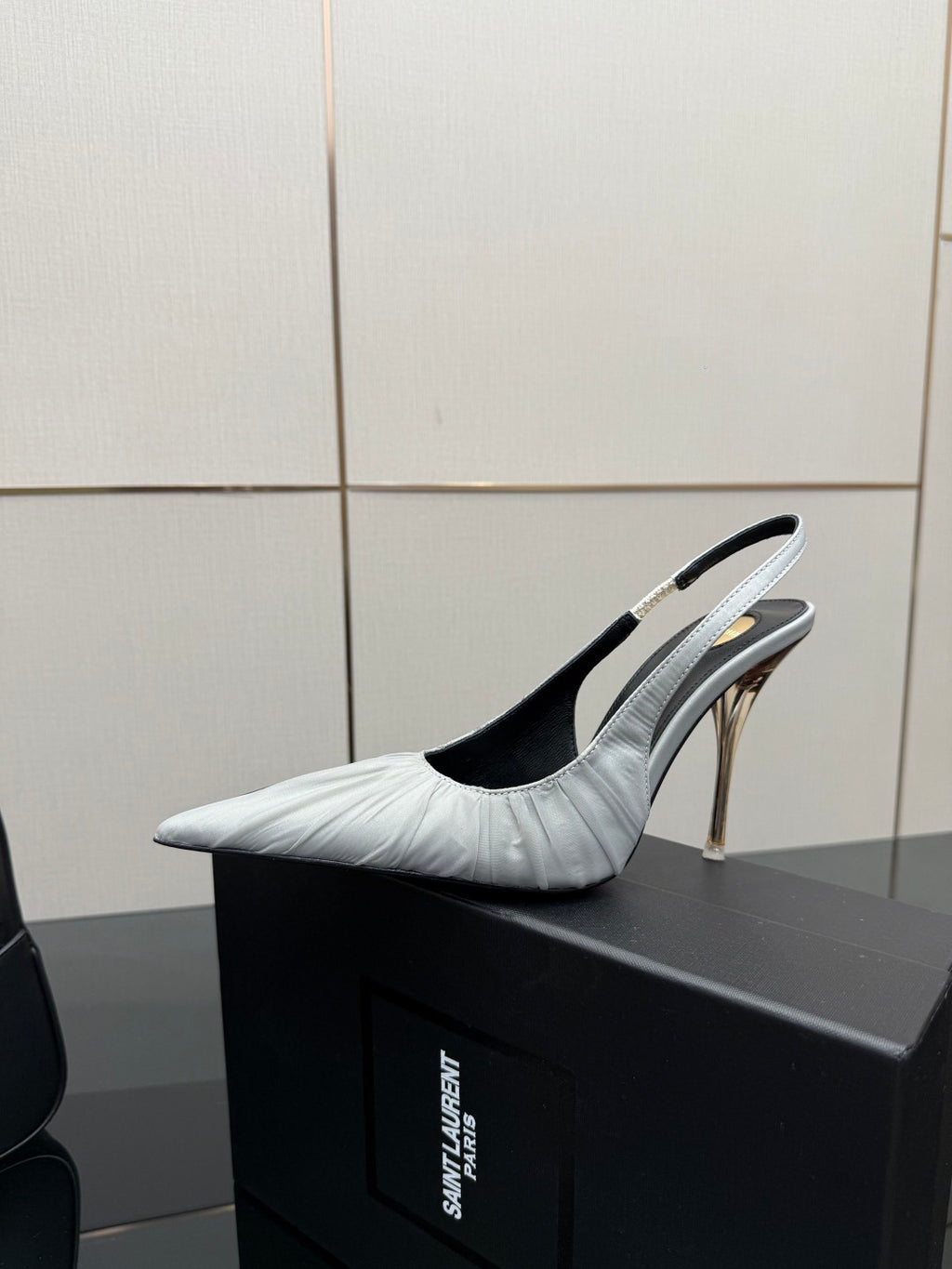 YSL ladies white pointed-toe slingback heel with thin gold stiletto and black sole