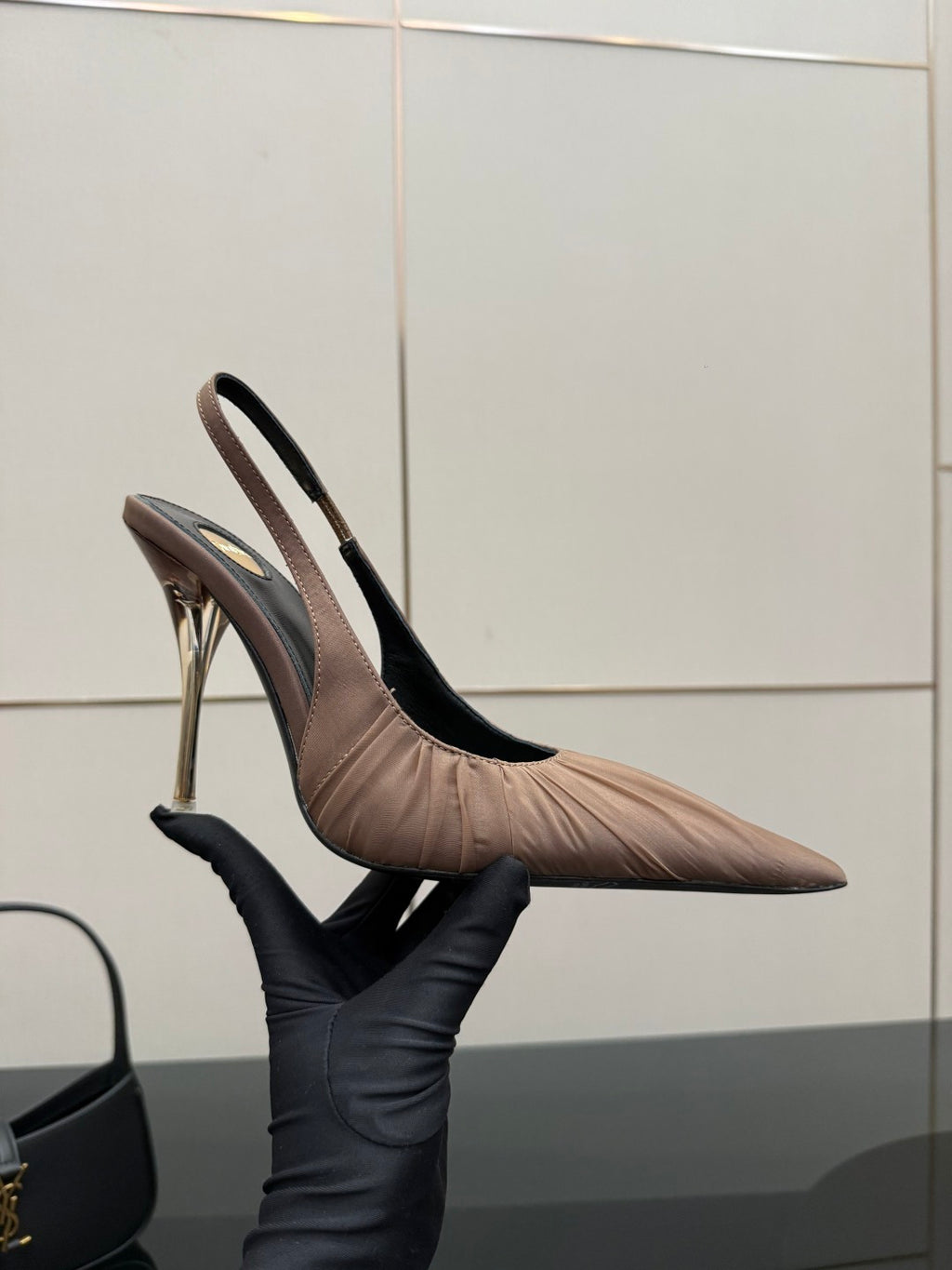 Women's nude pink slingback pump, side view with pointed toe and slim stiletto heel