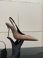 Women's nude pink slingback pump, side view with pointed toe and slim stiletto heel