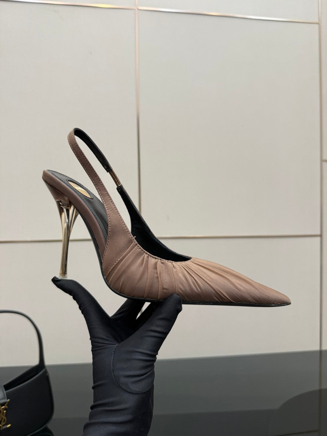 Women's nude pink slingback pump, side view with pointed toe and slim stiletto heel
