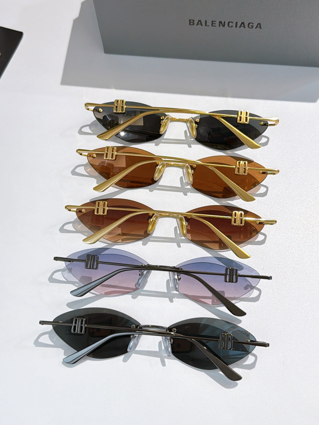 Balenciaga sunglasses assortment: gold and black frames with tinted lenses