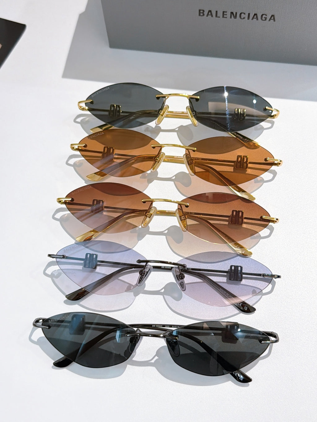 Balenciaga sunglasses assortment: gold and dark frames with tinted lenses