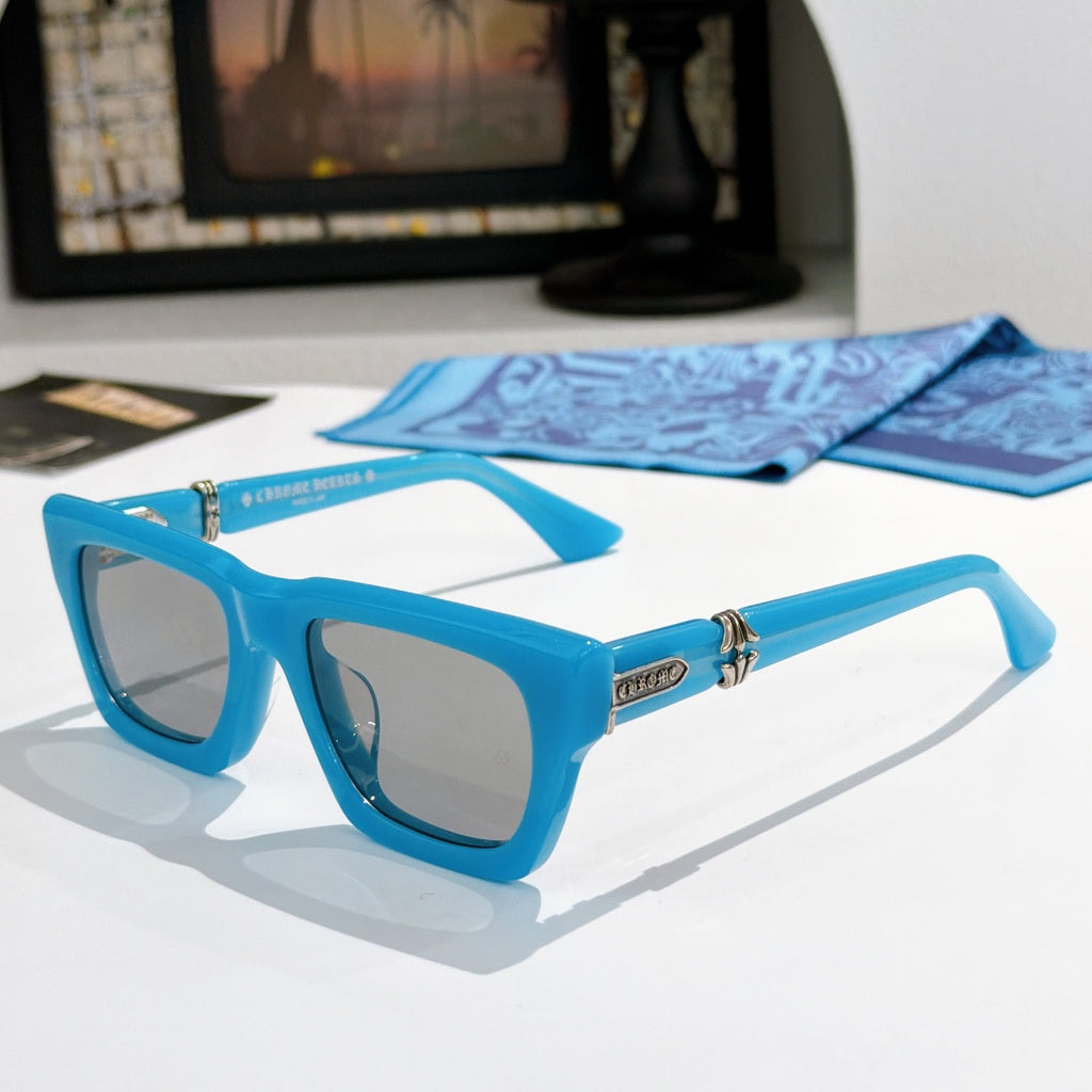Blue square sunglasses with tinted lenses and gold-tone logo detail on the arms