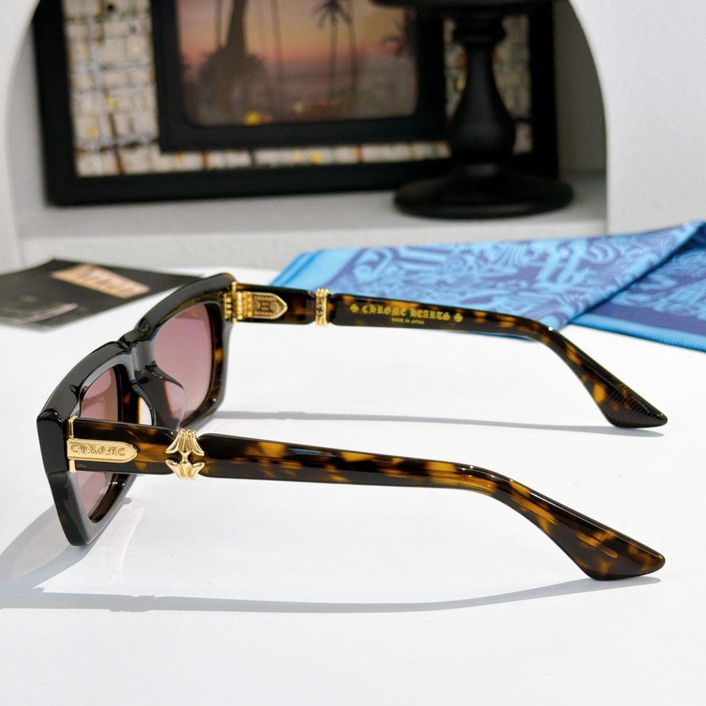 Tortoiseshell square sunglasses with pink-tinted lenses and gold-tone logo on arms