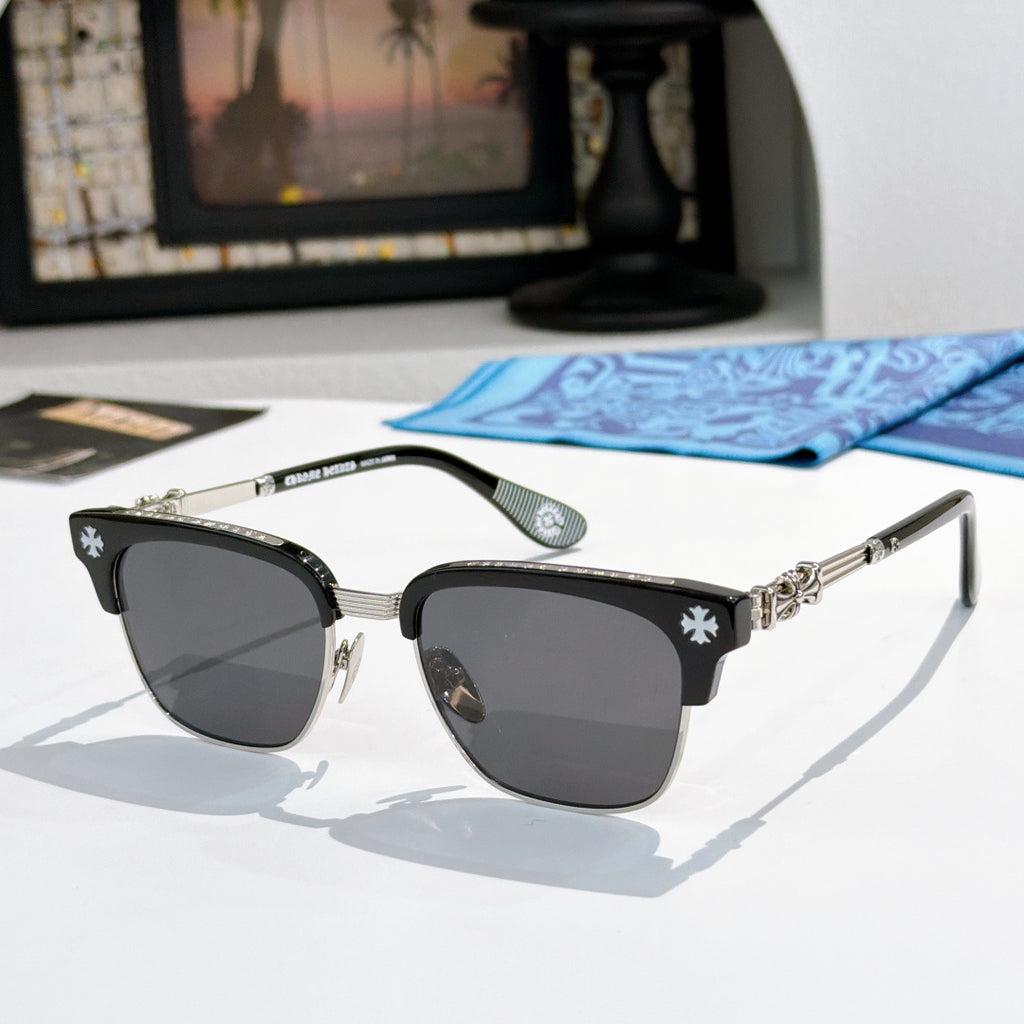 Chrome-framed glasses with black frames, star details, and dark lenses