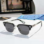 Chrome-framed glasses with black frames, star details, and dark lenses