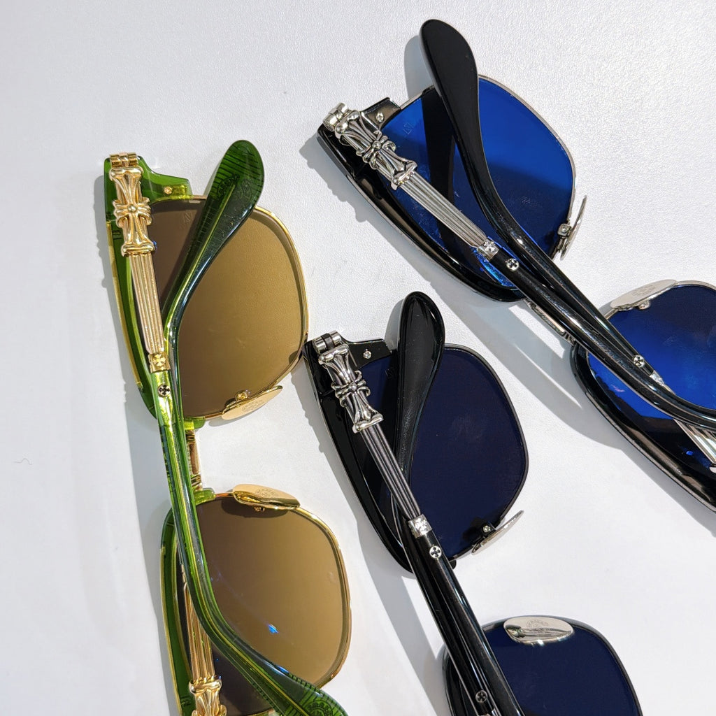Chrome-framed glasses in gold and blue with tinted lenses
