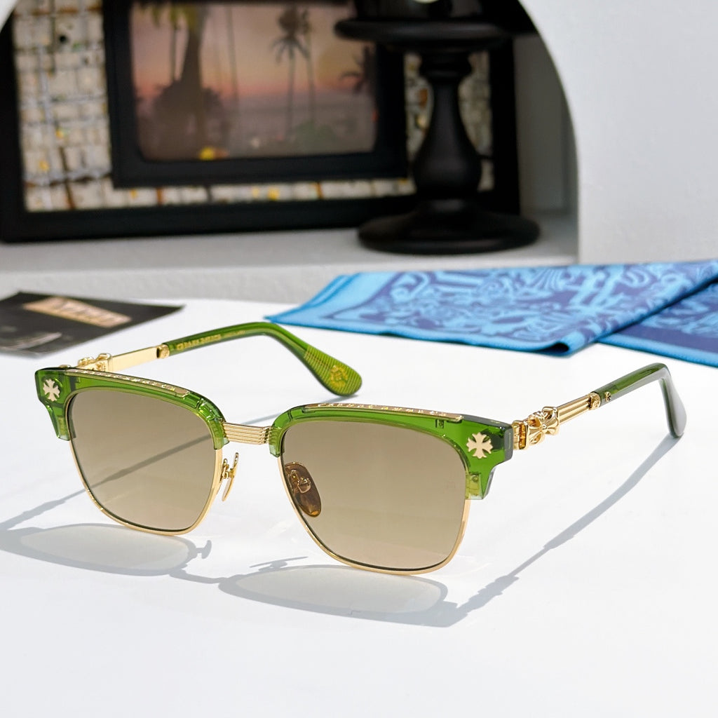 Chrome-framed glasses with green frame accents and amber-tinted lenses