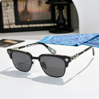 Chrome-framed glasses with black frames and dark lenses