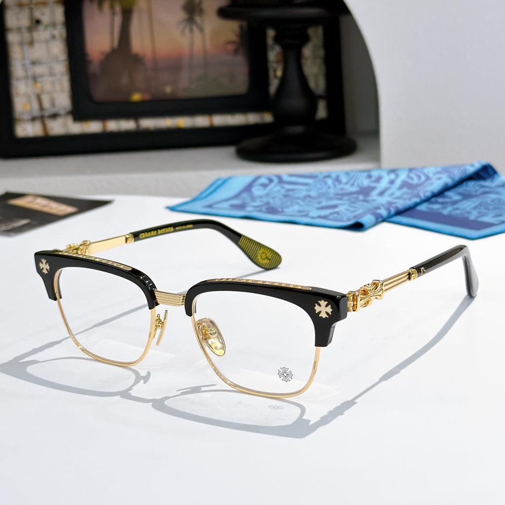 Metal eyeglasses with clear lenses, black-and-gold frame, and decorative temples
